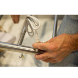 Person connecting electric hard wire in to WarmUp Electric Towel Warmer 